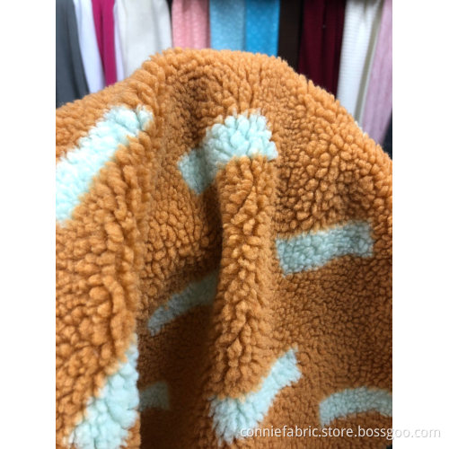100% polyester sherpa jacquard med mönster